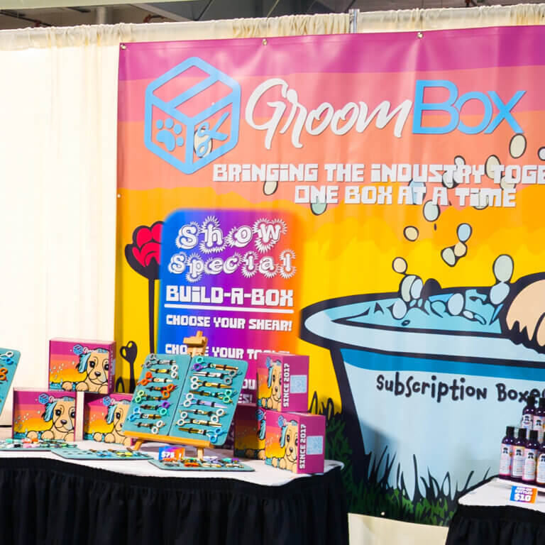 dog grooming supplies at a trade show GroomBox, a subscription box for dog groomers who practice dog grooming.
