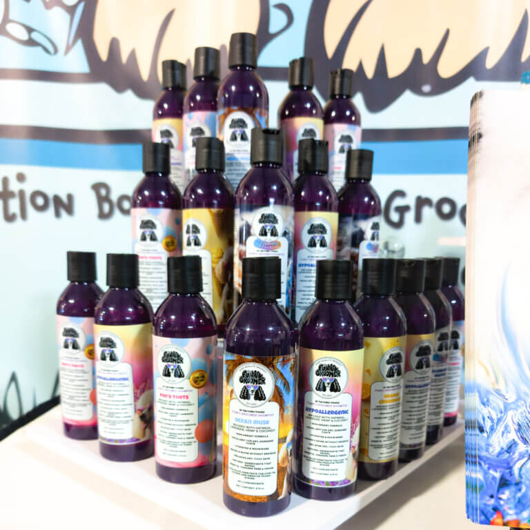 dog grooming supplies at a trade show GroomBox, a subscription box for dog groomers who practice dog grooming.