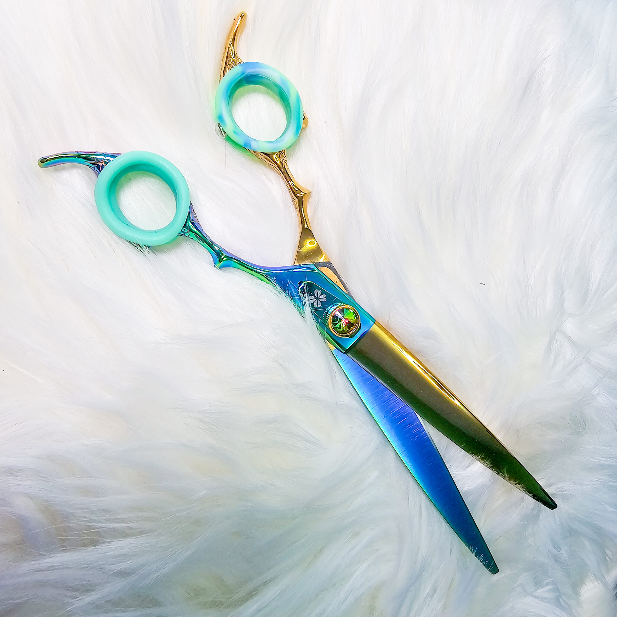 Lucky Curves reversible dog grooming shears with curved blade, four-leaf clover emblem, and ball bearing system by GroomBox.