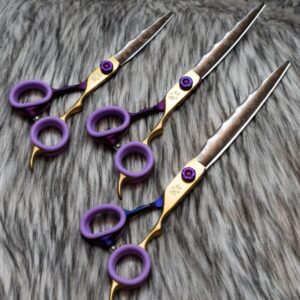 Nebula straight dog grooming shears sitting on fur for professional dog groomers.