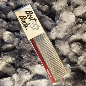Best Buds slant tooth dog grooming comb with red spine and angled metal teeth on gray fur background
